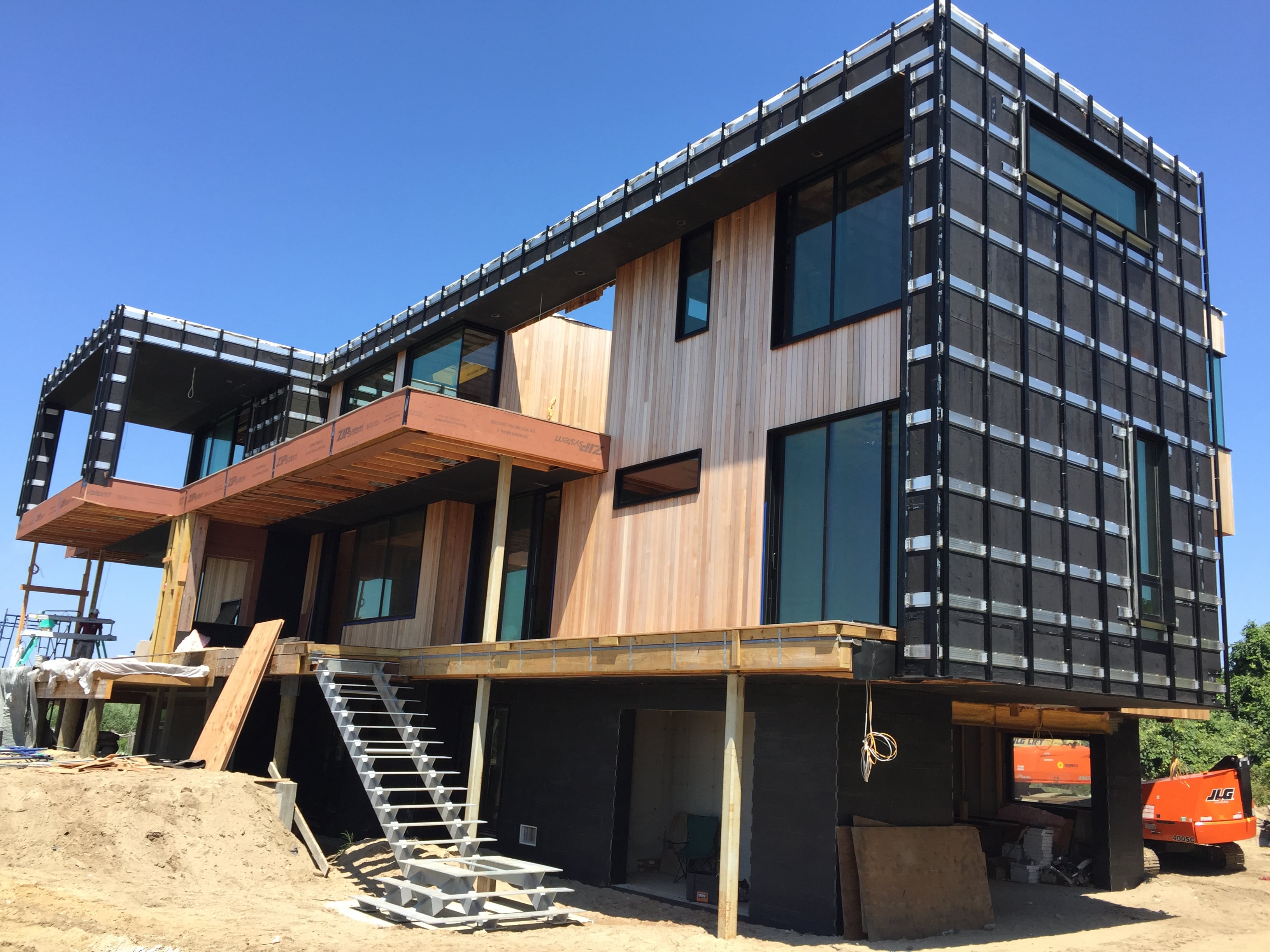 Under Construction Home in the Hamptons using Ebony Planc on the lower lever exterior facade